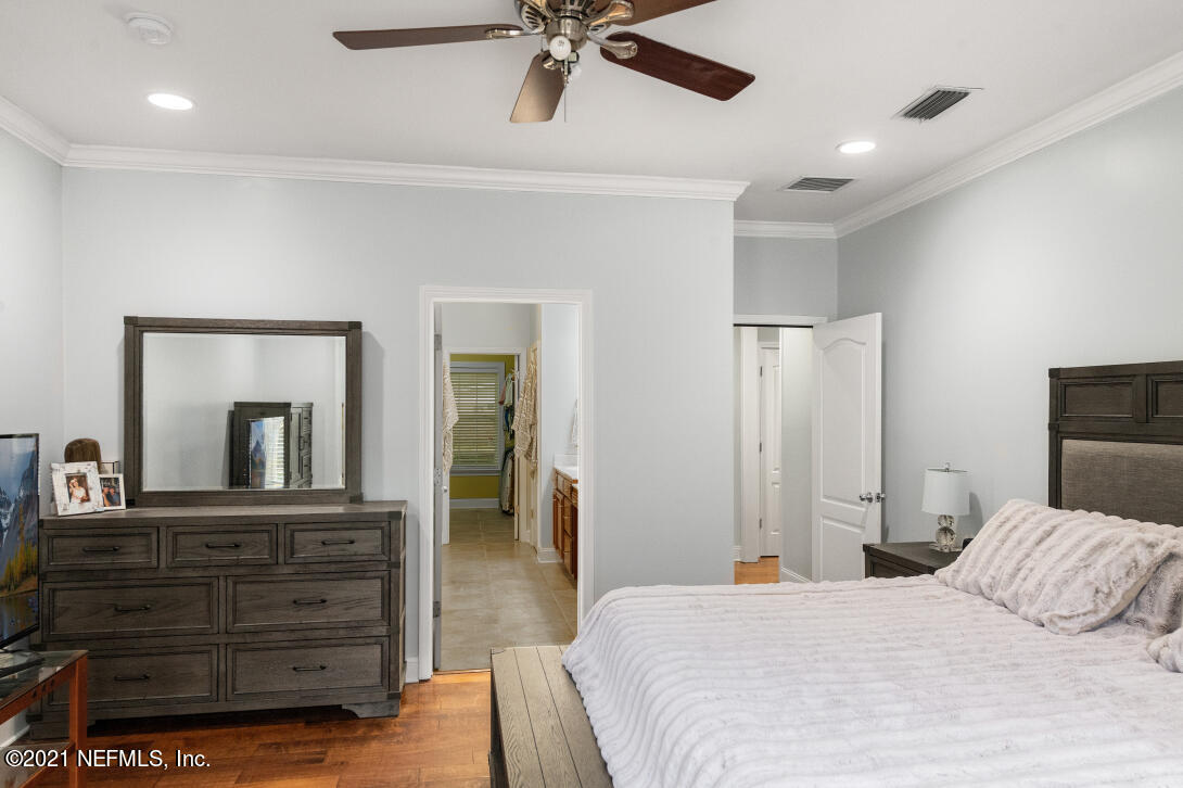 97002 Po Folks Way Yulee, FL 32097 - Photo 27 of 57 a bedroom with a bed and a dresser