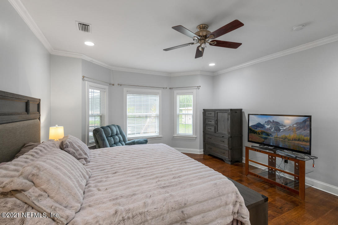 97002 Po Folks Way Yulee, FL 32097 - Photo 31 of 57 a bedroom with a bed and a flat screen tv