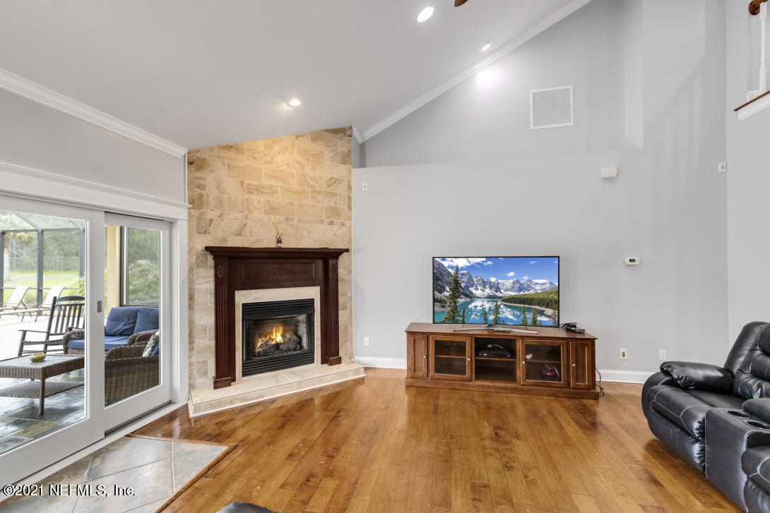 97002 Po Folks Way Yulee, FL 32097 - Photo 32 of 57 a living room with furniture and a fireplace