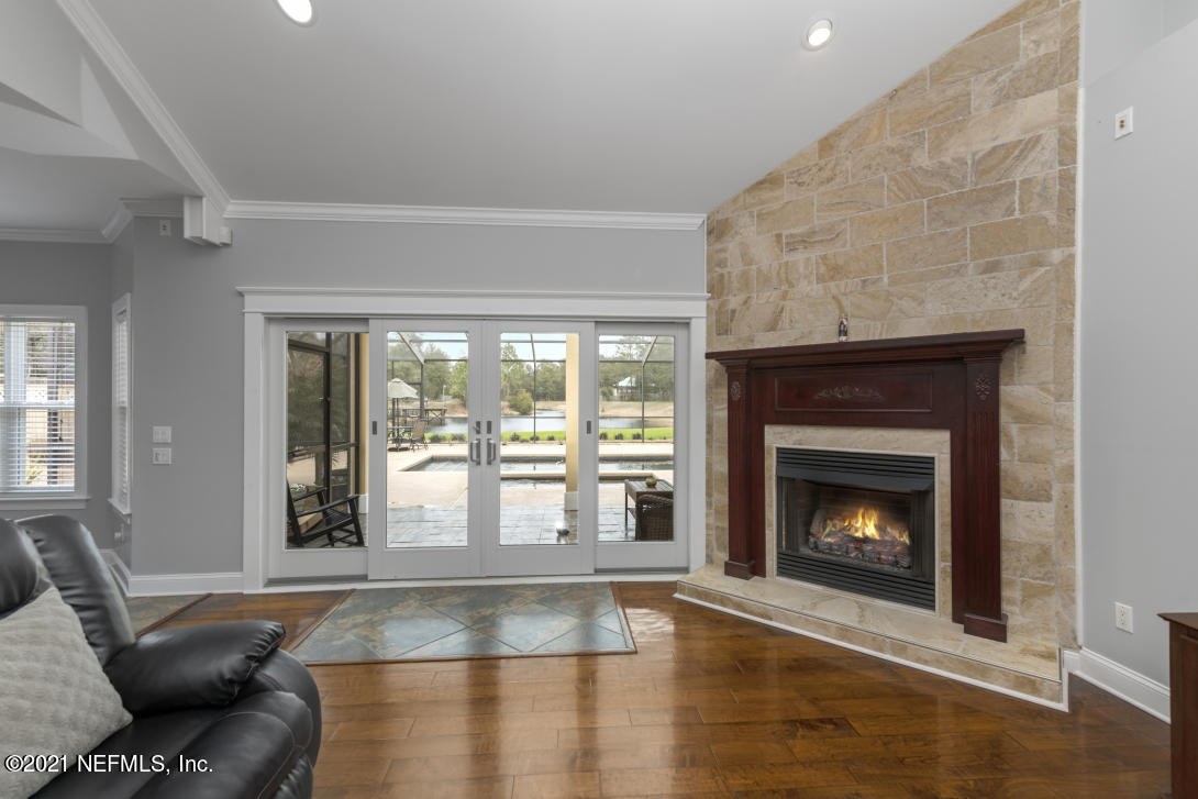 97002 Po Folks Way Yulee, FL 32097 - Photo 34 of 57 a living room with furniture and a fireplace