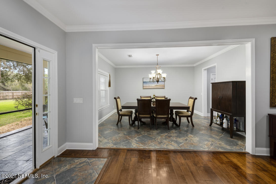 97002 Po Folks Way Yulee, FL 32097 - Photo 36 of 57 a view of a dining room with furniture window and wooden floor