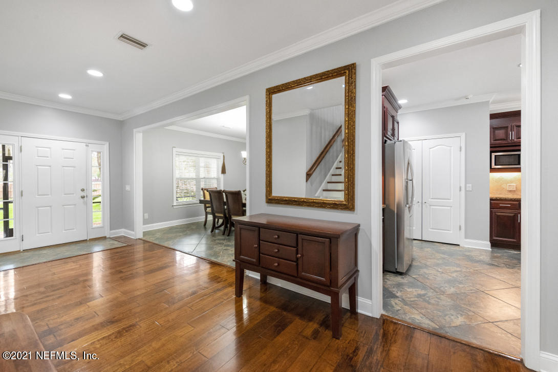 97002 Po Folks Way Yulee, FL 32097 - Photo 37 of 57 a view of an entryway door and wooden floor