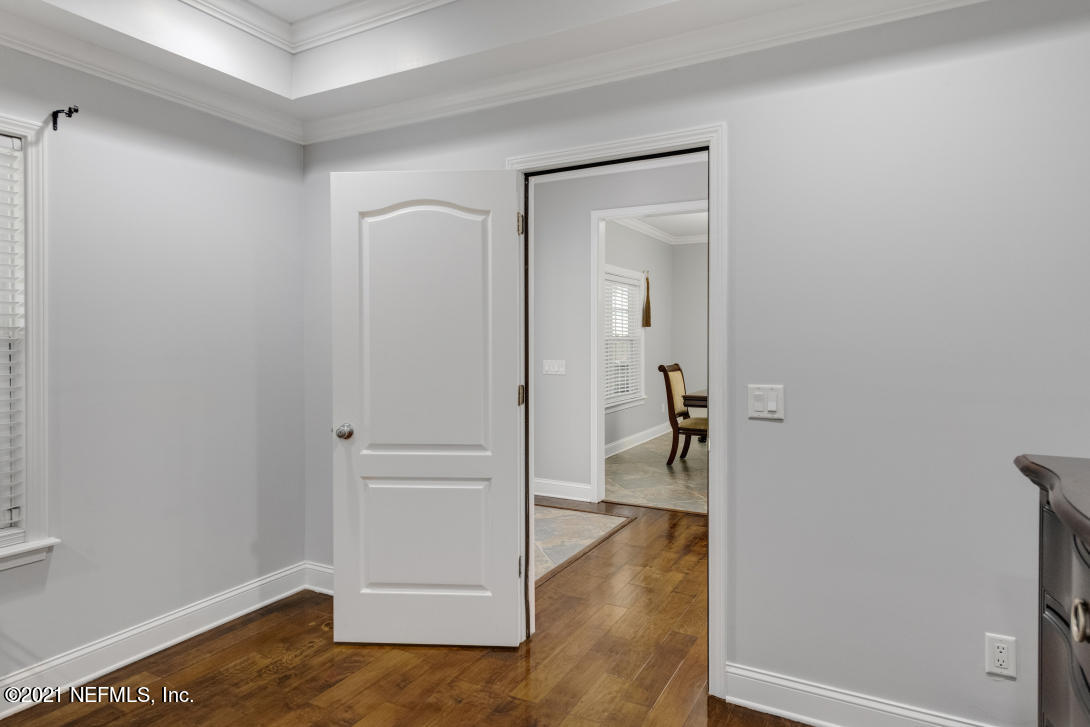 97002 Po Folks Way Yulee, FL 32097 - Photo 38 of 57 a view of a hallway with wooden floor and a livingroom