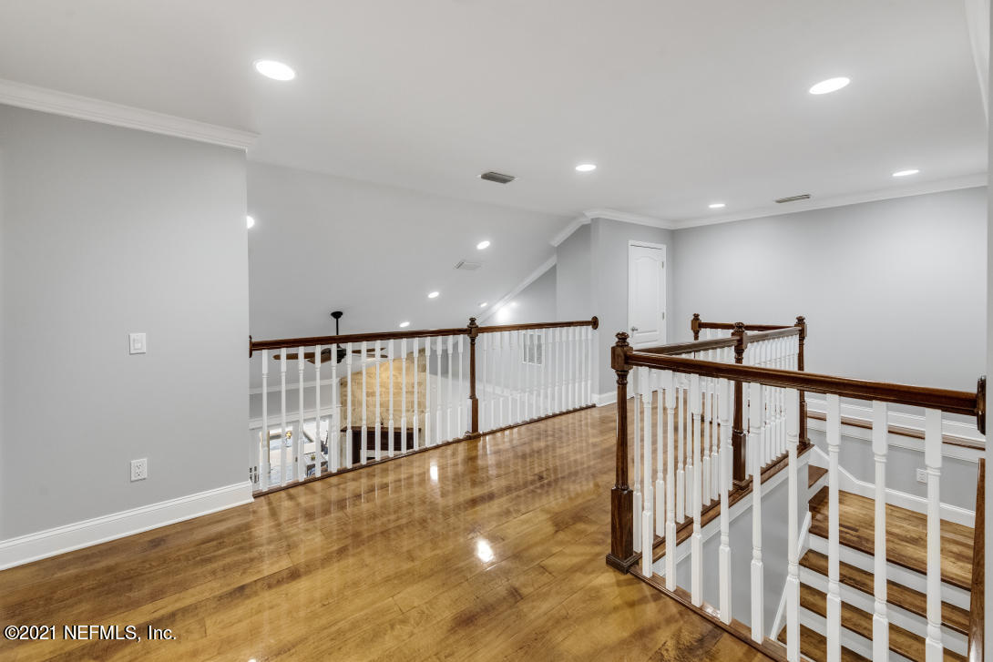 97002 Po Folks Way Yulee, FL 32097 - Photo 43 of 57 a view of a hallway with wooden floor