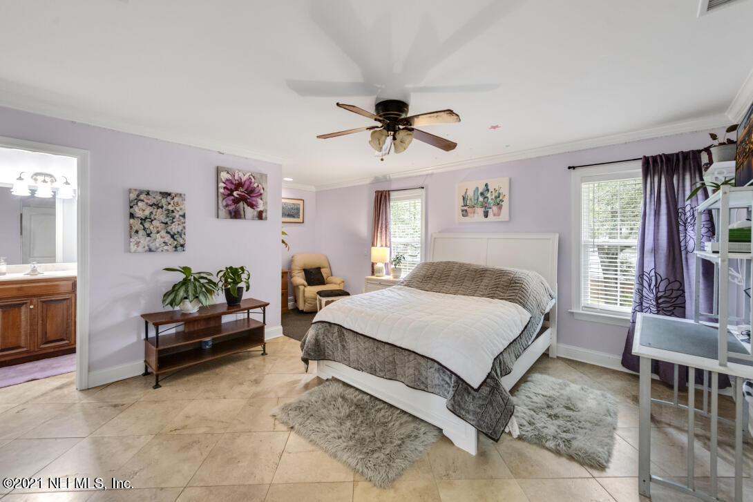 97002 Po Folks Way Yulee, FL 32097 - Photo 52 of 57 a bedroom with a bed furniture and windows