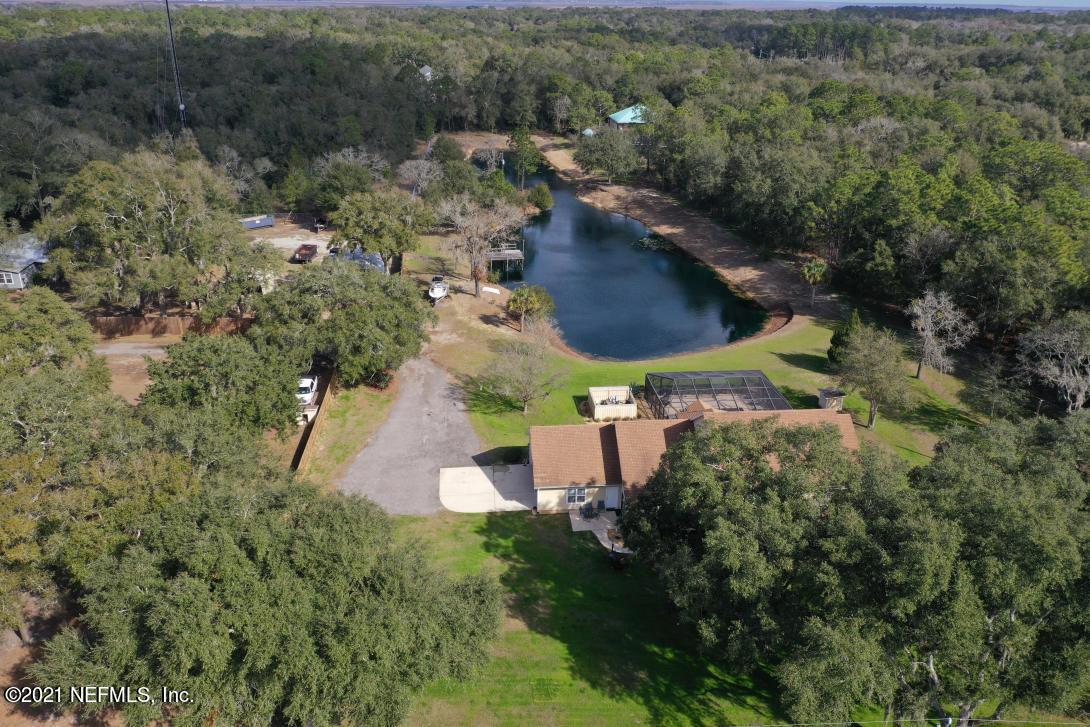97002 Po Folks Way Yulee, FL 32097 - Photo 53 of 57 an aerial view of residential house with outdoor space and trees all around
