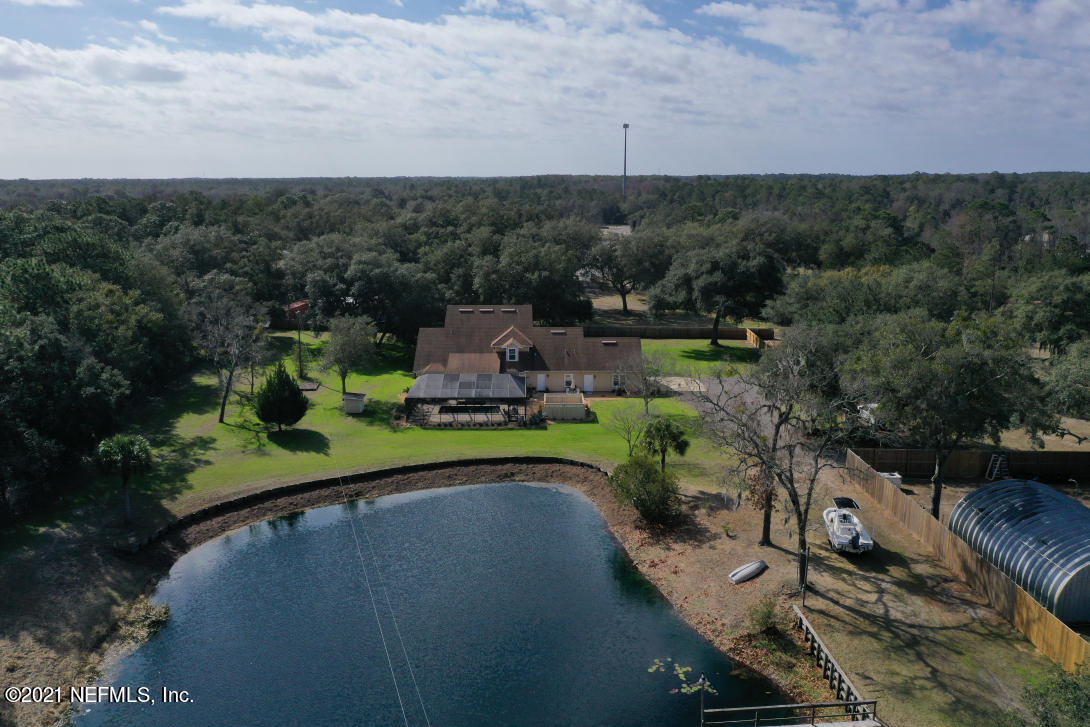 97002 Po Folks Way Yulee, FL 32097 - Photo 55 of 57 a view of a table and chairs in patio