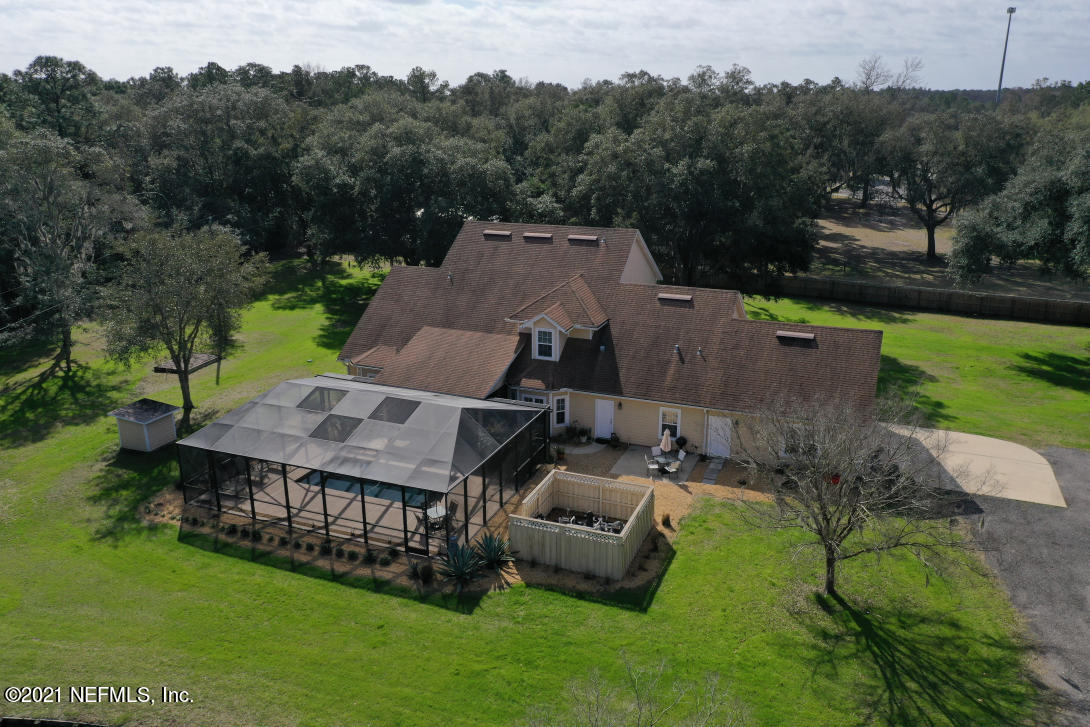 97002 Po Folks Way Yulee, FL 32097 - Photo 7 of 57 an aerial view of a house with backyard garden and outdoor seating