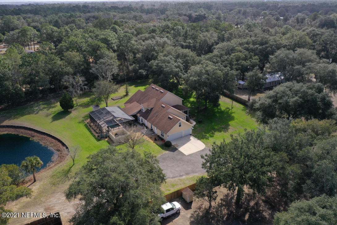 97002 Po Folks Way Yulee, FL 32097 - Photo 8 of 57 an aerial view of a house with a yard