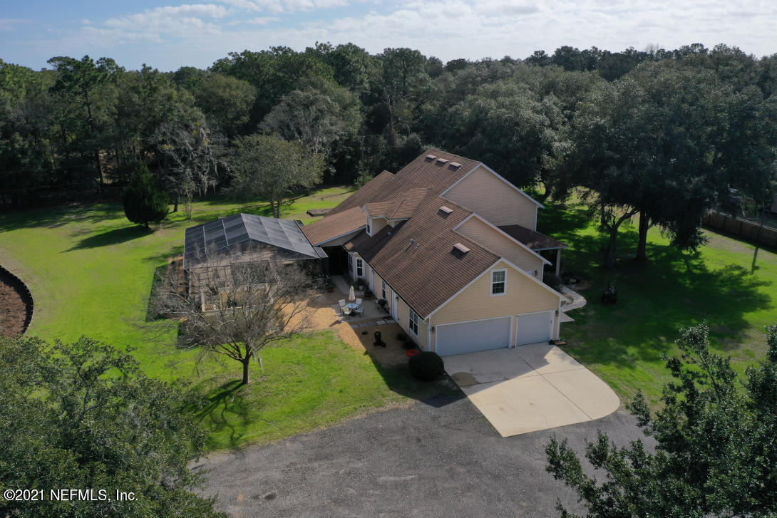 97002 Po Folks Way Yulee, FL 32097 - Photo 9 of 57 an aerial view of a house with a garden