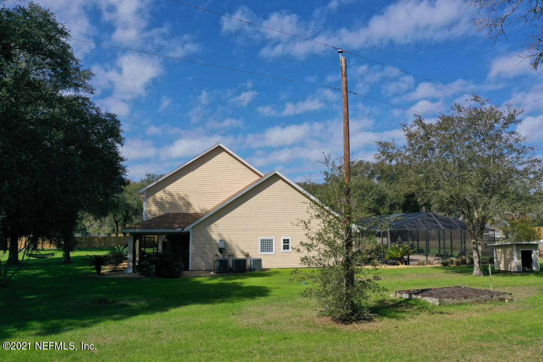 97002 Po Folks Way Yulee, FL 32097 - Photo 10 of 57 a view of a house with a yard