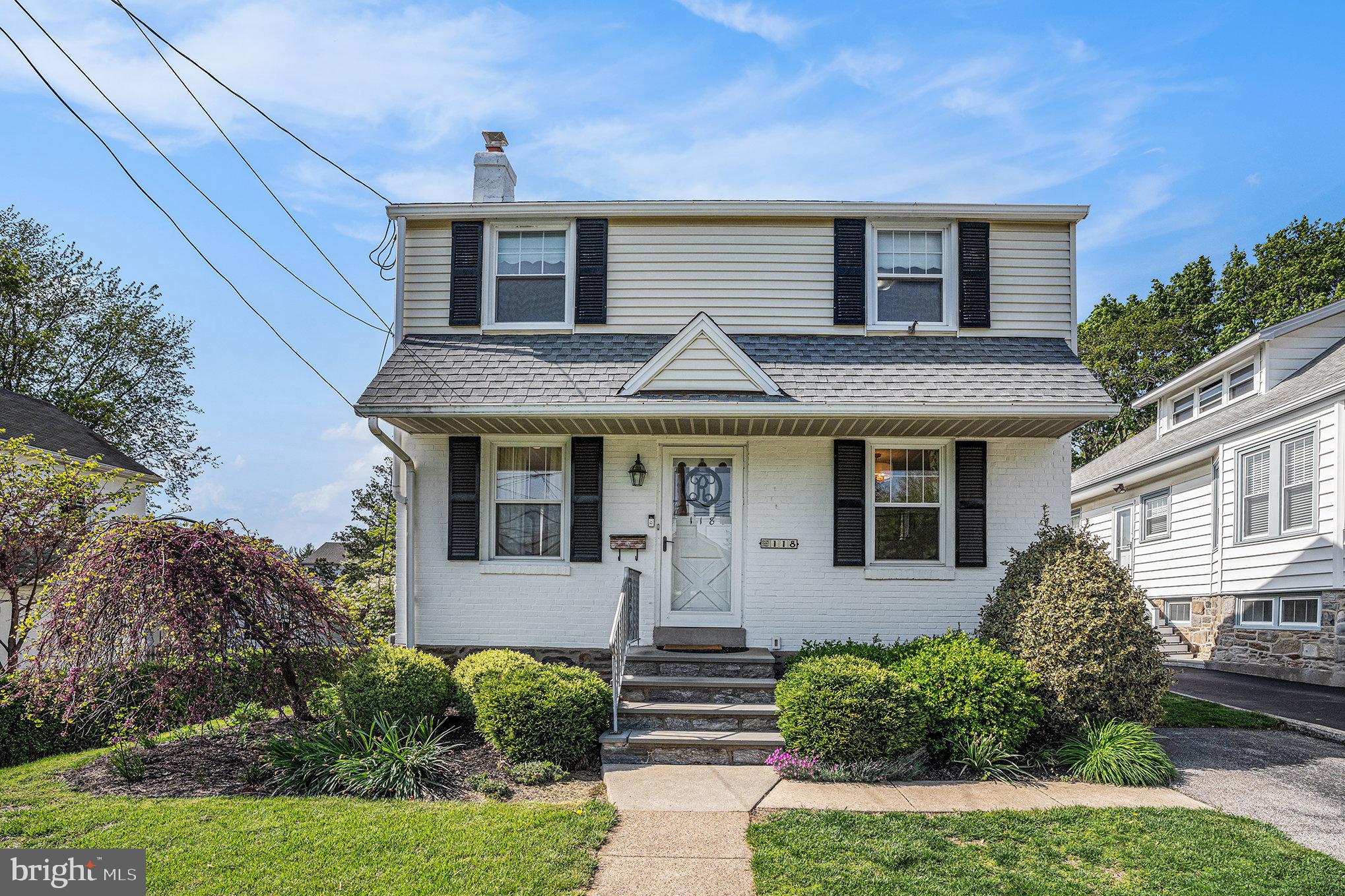118 Colfax Road Havertown, PA 19083 - Photo 1 of 15 a front view of a house with garden