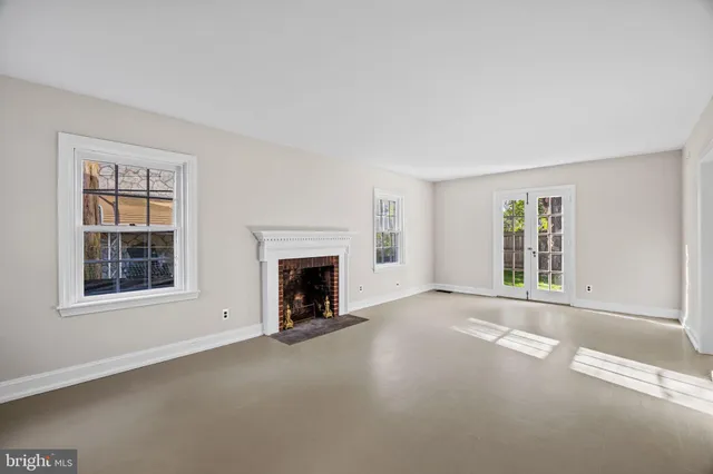 an empty room with windows