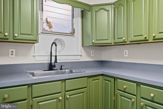 a kitchen with a refrigerator and a cabinets