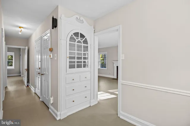a bathroom with a sink toilet and mirror