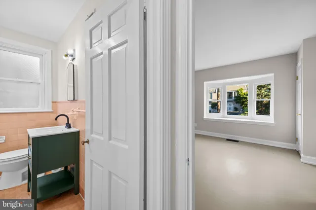 a view of an empty room and wooden floor