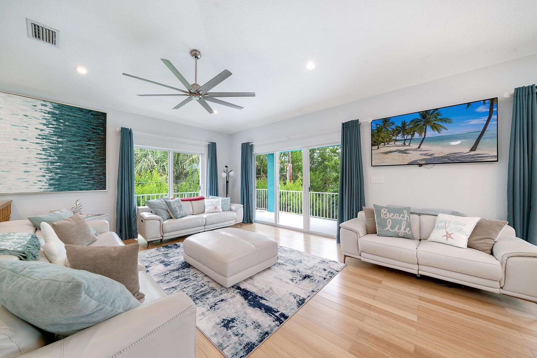 191 Carroll Street Islamorada, FL 33036 - Photo 15 of 40 a living room with furniture and a large window