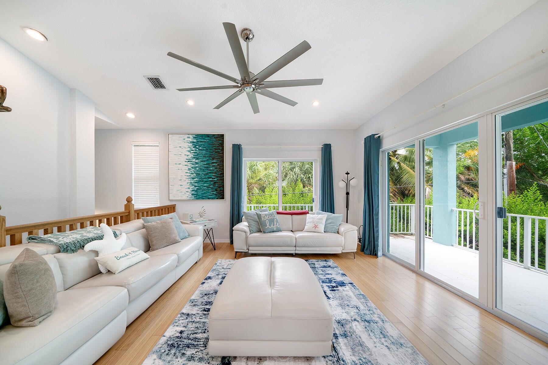 191 Carroll Street Islamorada, FL 33036 - Photo 19 of 40 a living room with furniture and a large window