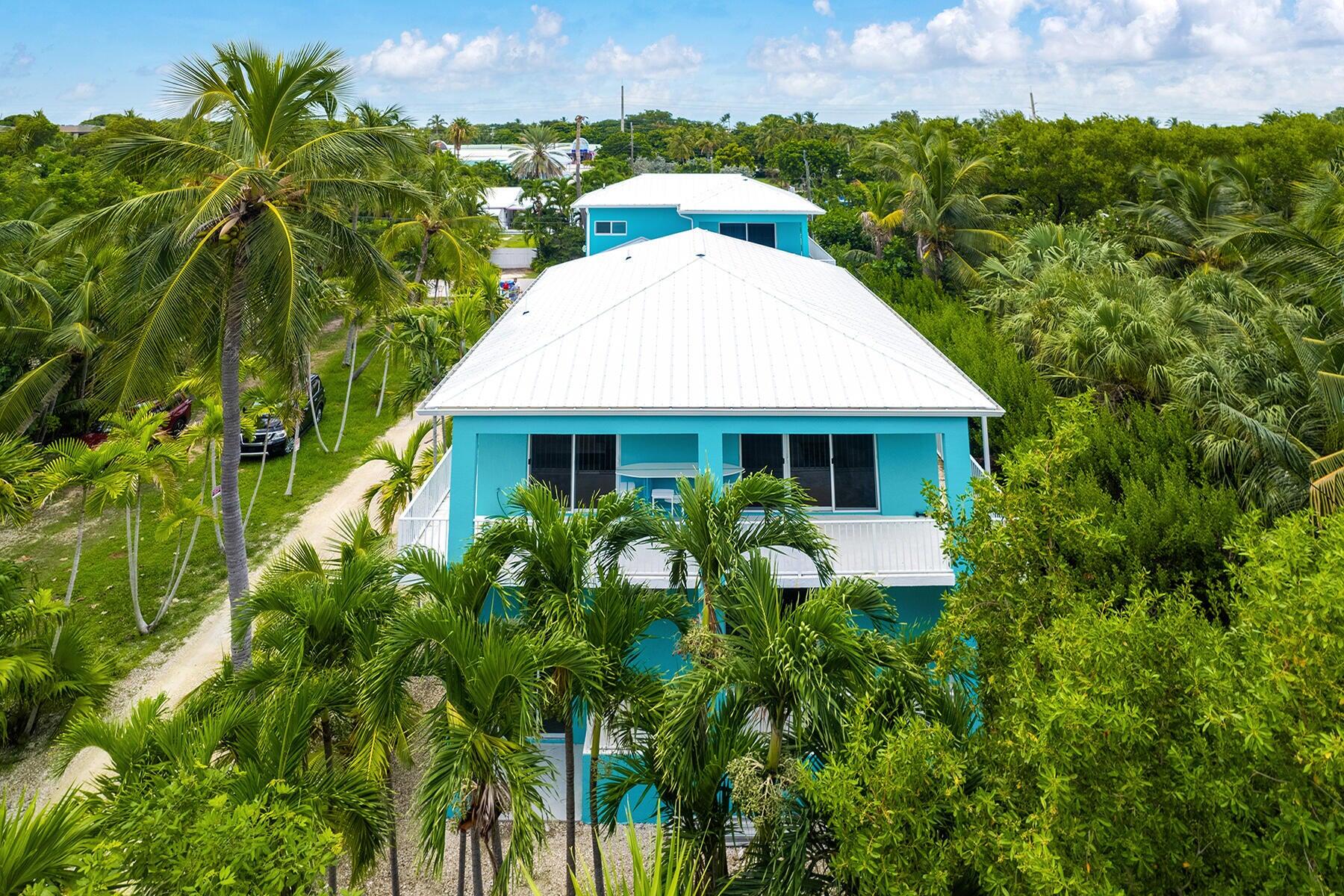 191 Carroll Street Islamorada, FL 33036 - Photo 2 of 40 a aerial view of a house with balcony