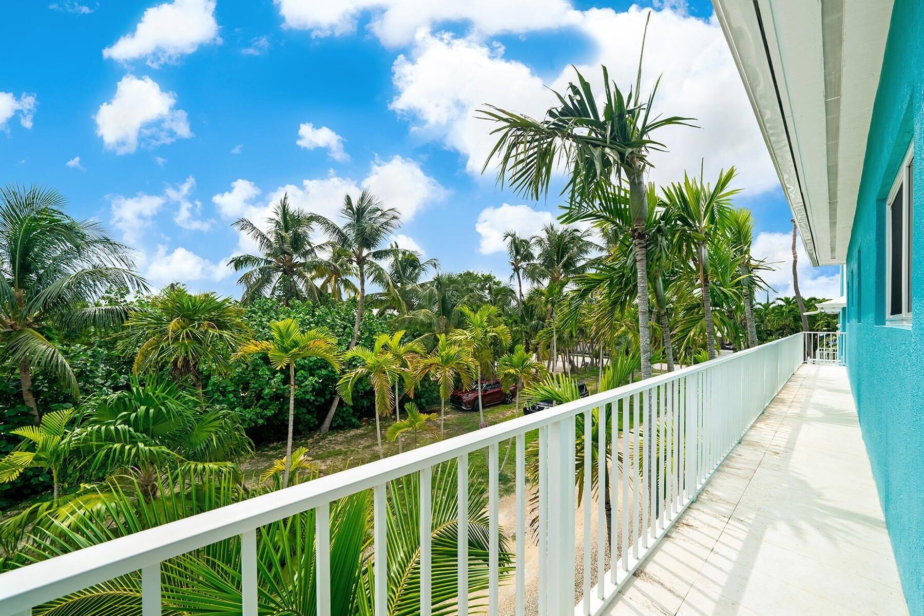 191 Carroll Street Islamorada, FL 33036 - Photo 32 of 40 a view of a balcony with a tree