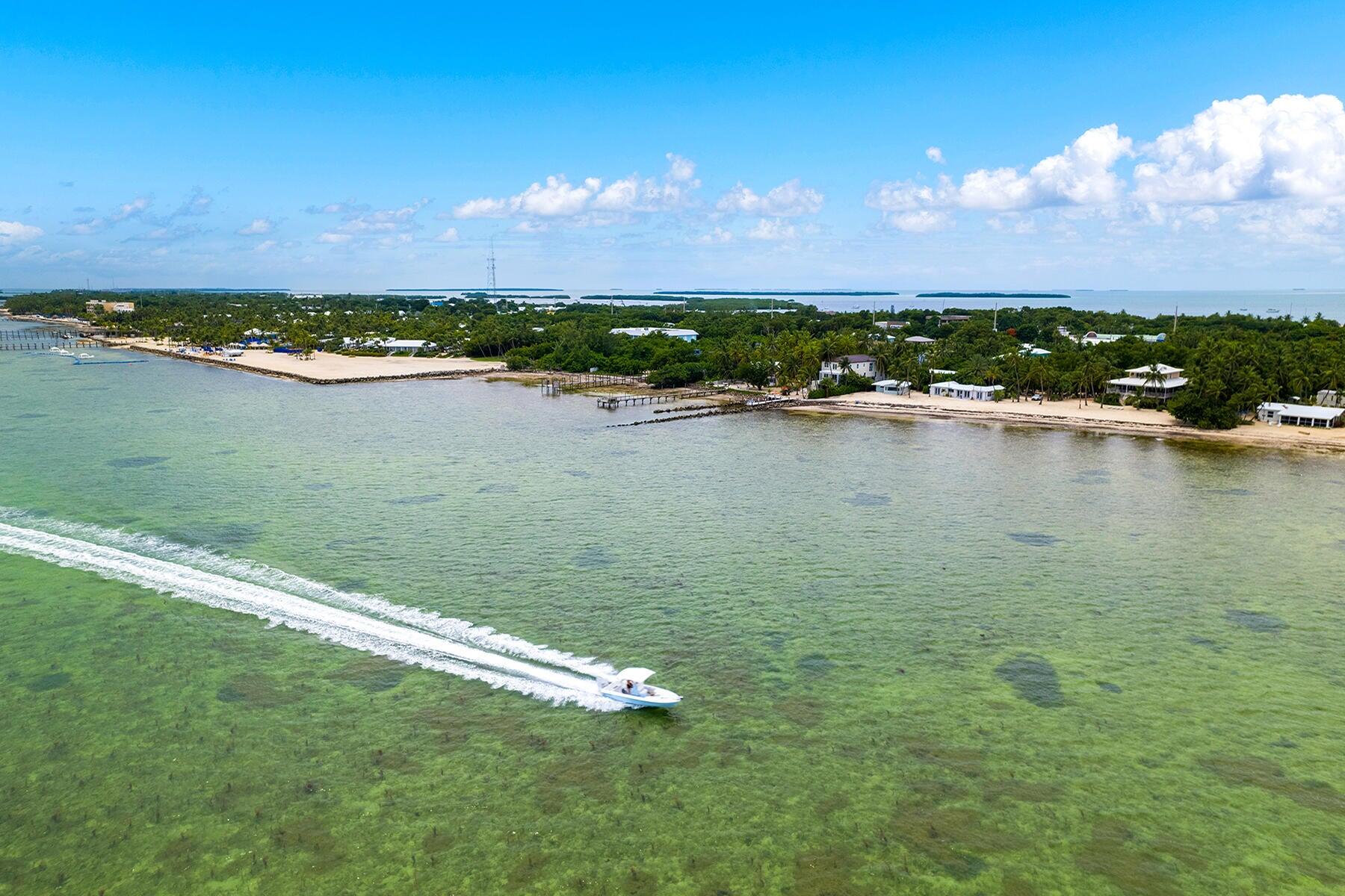 191 Carroll Street Islamorada, FL 33036 - Photo 39 of 40 a view of a lake with houses in the back