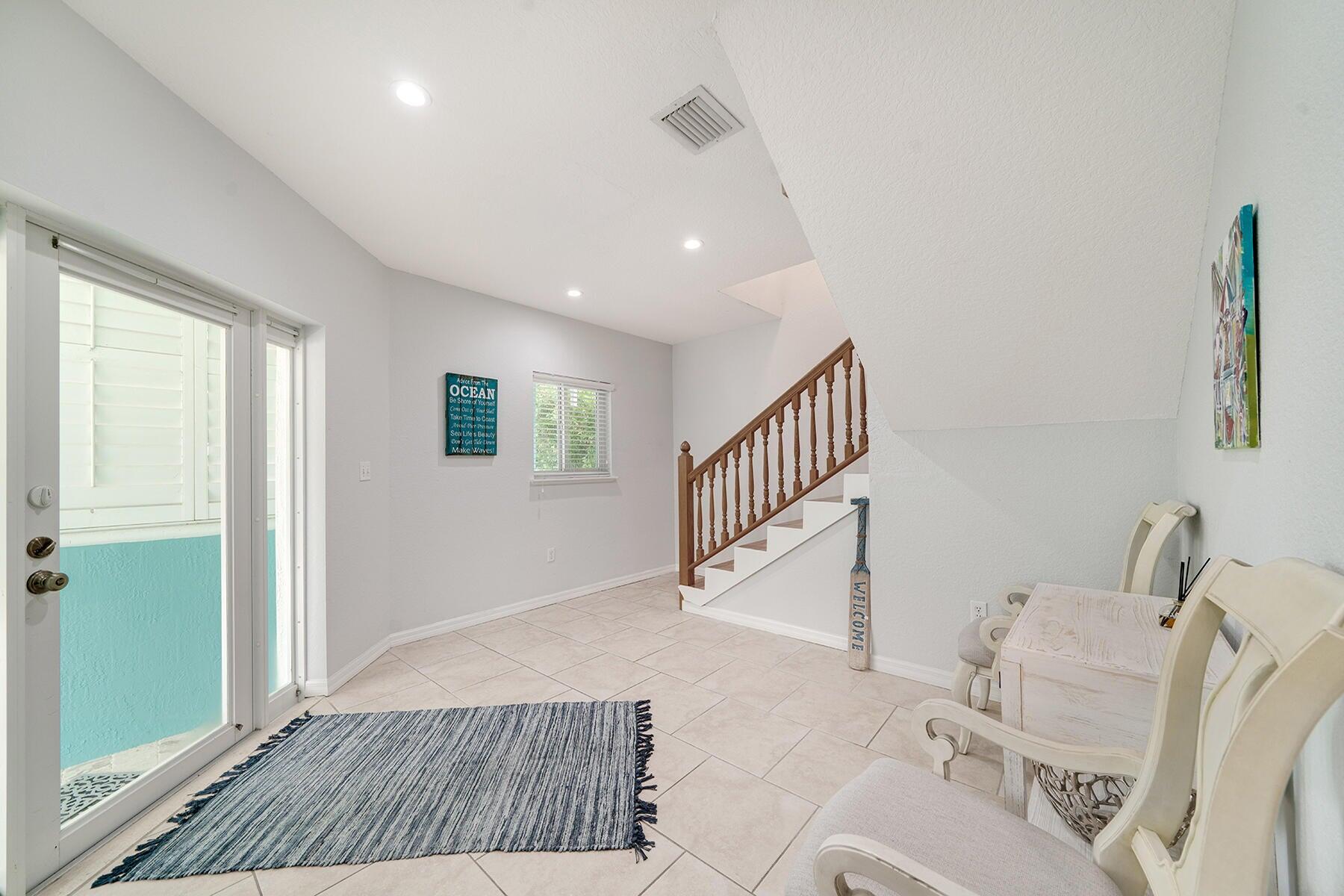 191 Carroll Street Islamorada, FL 33036 - Photo 6 of 40 a living room with furniture and a wooden floor