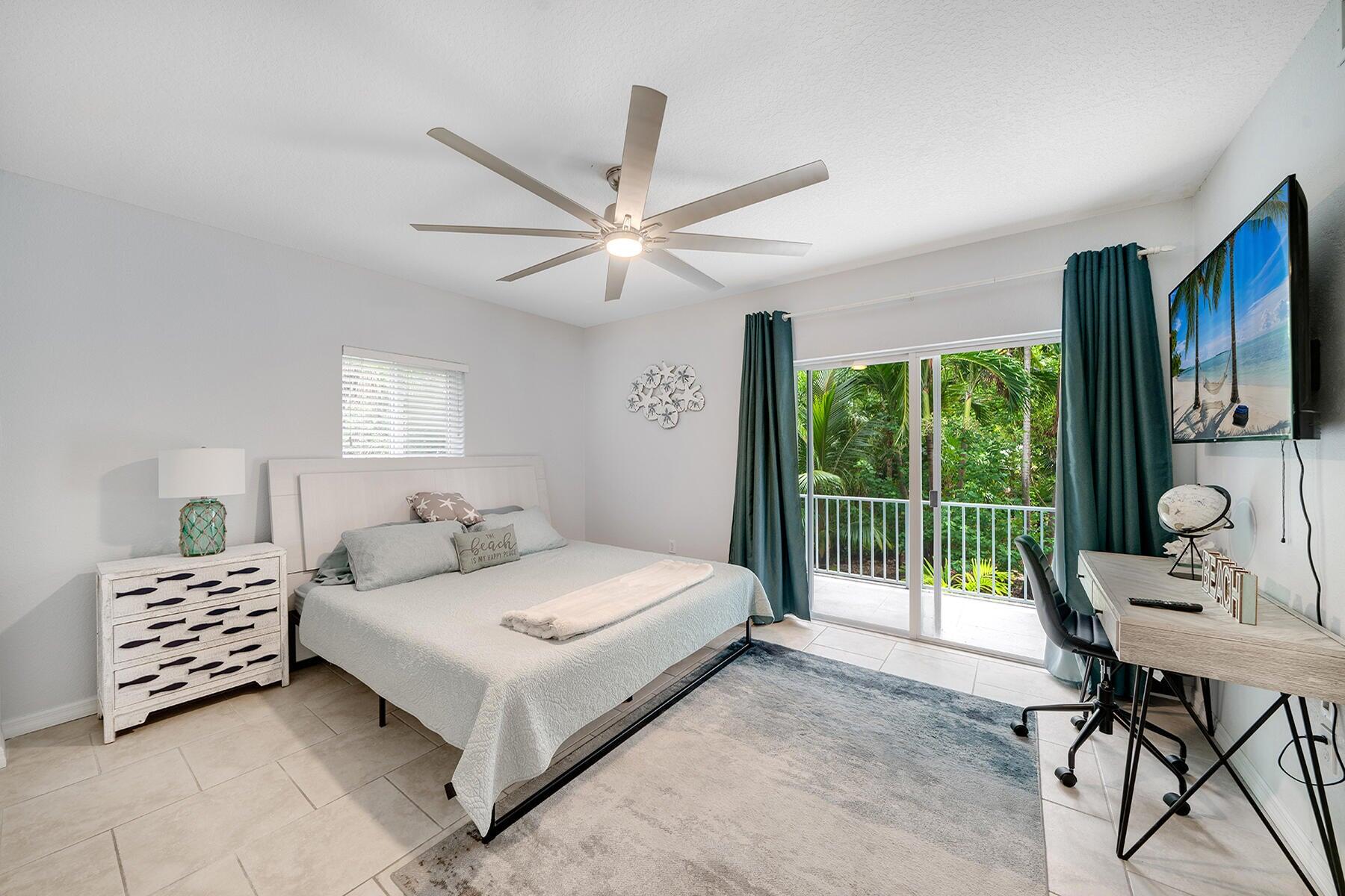 191 Carroll Street Islamorada, FL 33036 - Photo 9 of 40 a bedroom with a bed and a large window