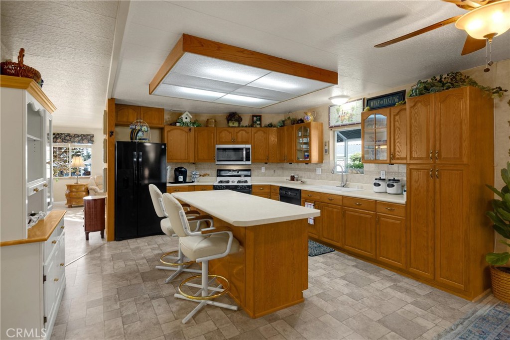 10210 Base Line Road, Unit 235 Rancho Cucamonga, CA 91701 - Photo 14 of 33 a kitchen with stainless steel appliances granite countertop a sink stove and refrigerator