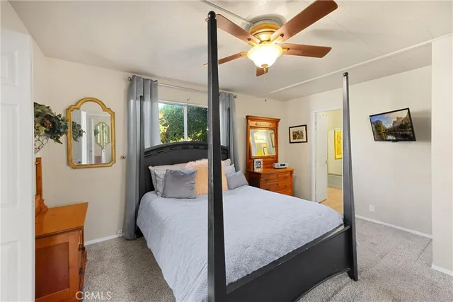 a bed room with a bed and a chandelier