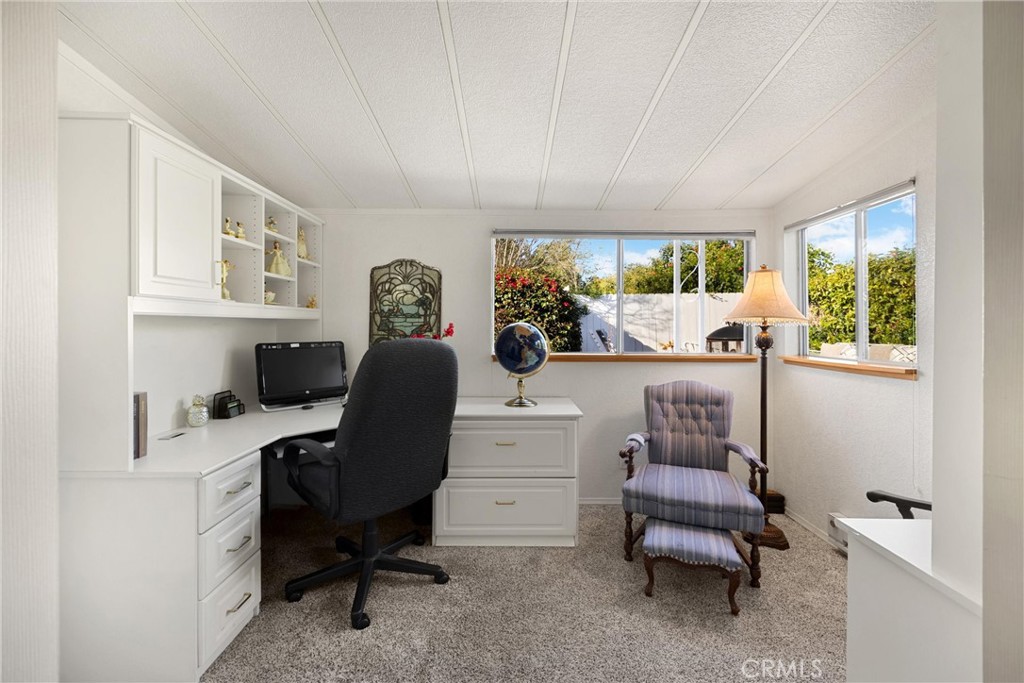 10210 Base Line Road, Unit 235 Rancho Cucamonga, CA 91701 - Photo 25 of 33 a view of a workspace with furniture and a window