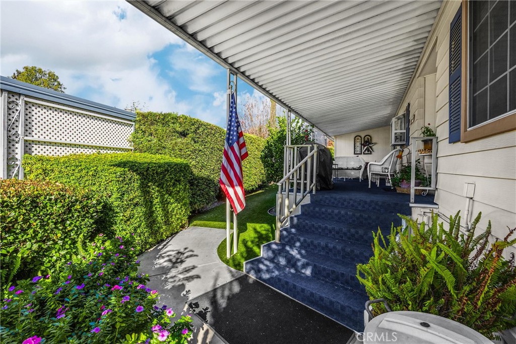 10210 Base Line Road, Unit 235 Rancho Cucamonga, CA 91701 - Photo 3 of 33 a view of a chairs and table in a backyard