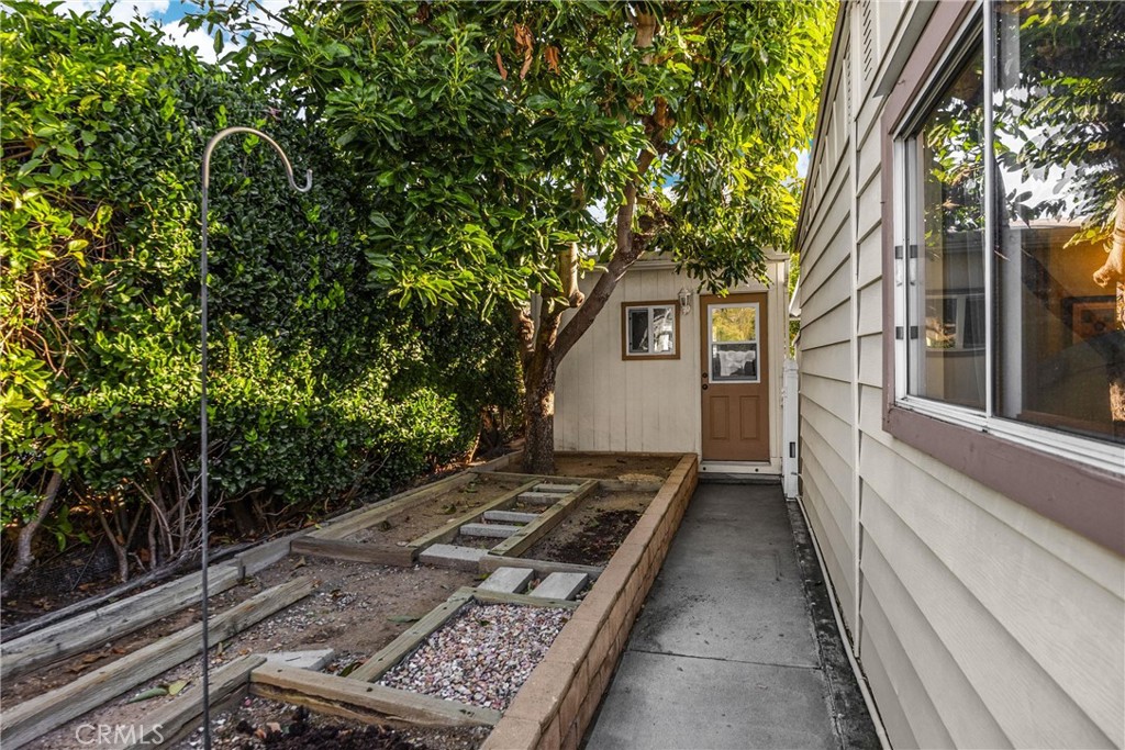 10210 Base Line Road, Unit 235 Rancho Cucamonga, CA 91701 - Photo 32 of 33 a view of a backyard with large trees