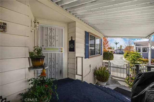 a view of a porch with potted plants