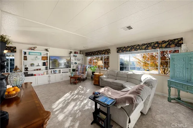 a living room with furniture and a table