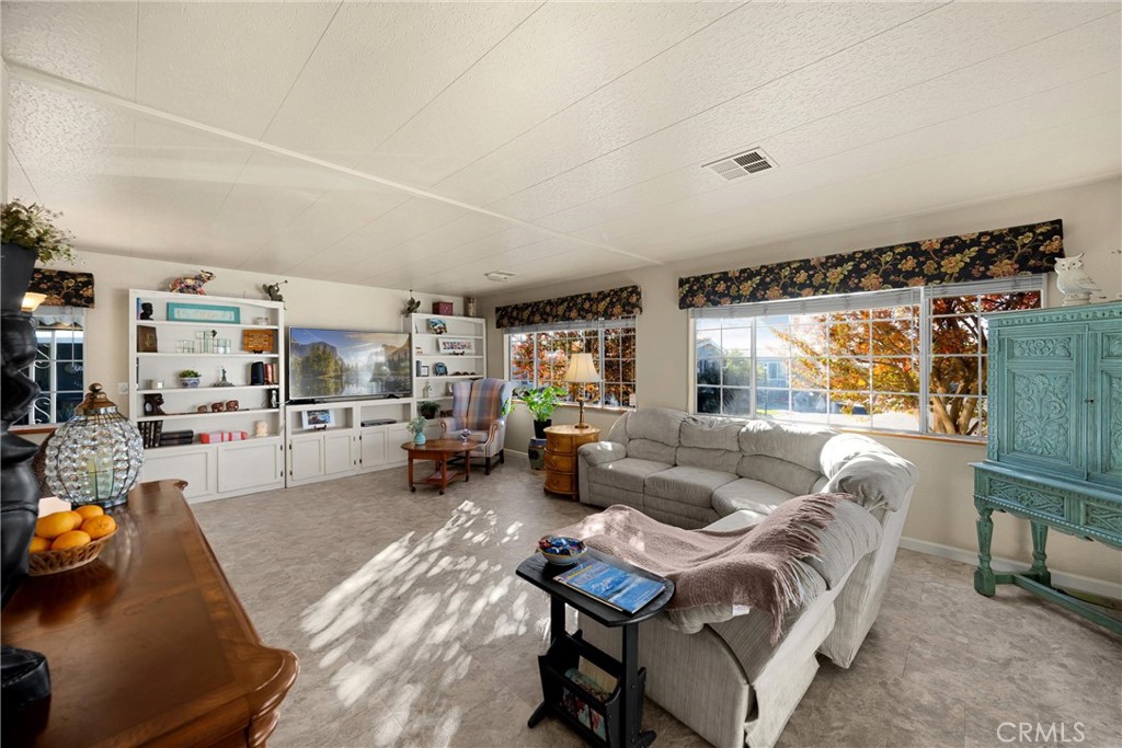 10210 Base Line Road, Unit 235 Rancho Cucamonga, CA 91701 - Photo 6 of 33 a living room with furniture and a table