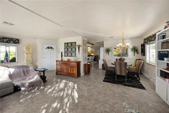 a living room with furniture window and wooden floor