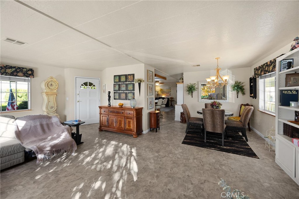 10210 Base Line Road, Unit 235 Rancho Cucamonga, CA 91701 - Photo 8 of 33 a living room with furniture window and wooden floor