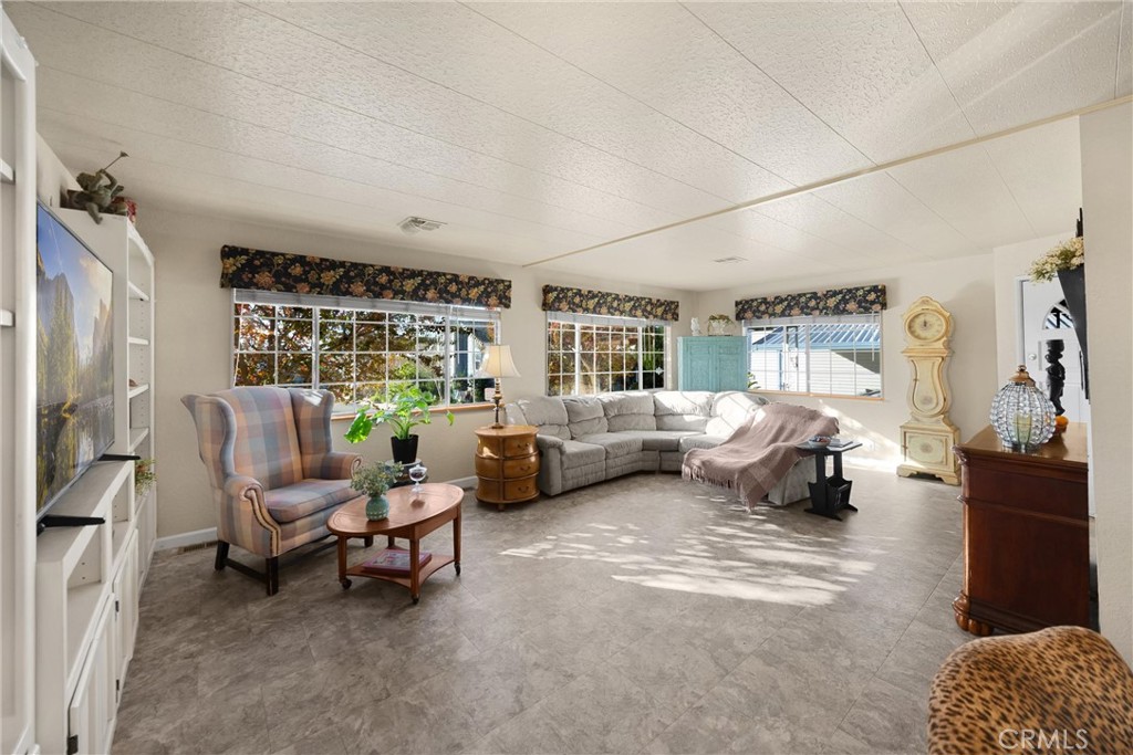 10210 Base Line Road, Unit 235 Rancho Cucamonga, CA 91701 - Photo 9 of 33 a bedroom with furniture and a large window