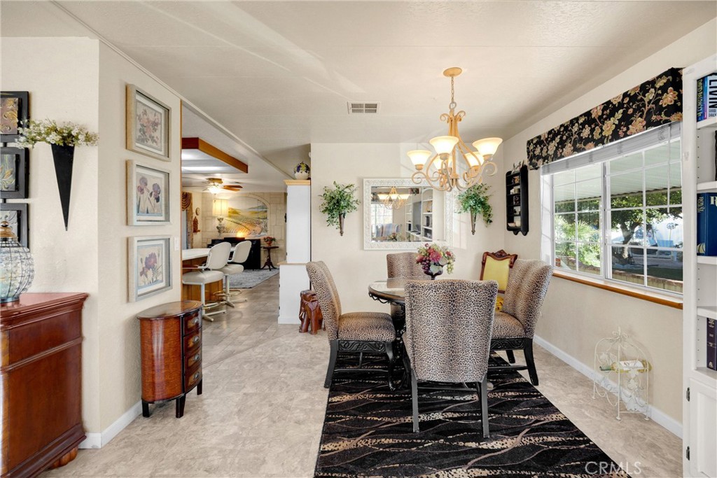 10210 Base Line Road, Unit 235 Rancho Cucamonga, CA 91701 - Photo 10 of 33 a view of a dining room with furniture window and outside view