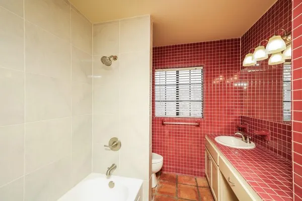 a bathroom with a sink shower and a bathtub