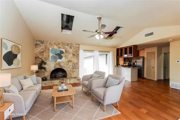 a living room with furniture and a fireplace