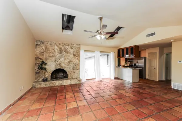 a view of a kitchen with microwave and cabinets