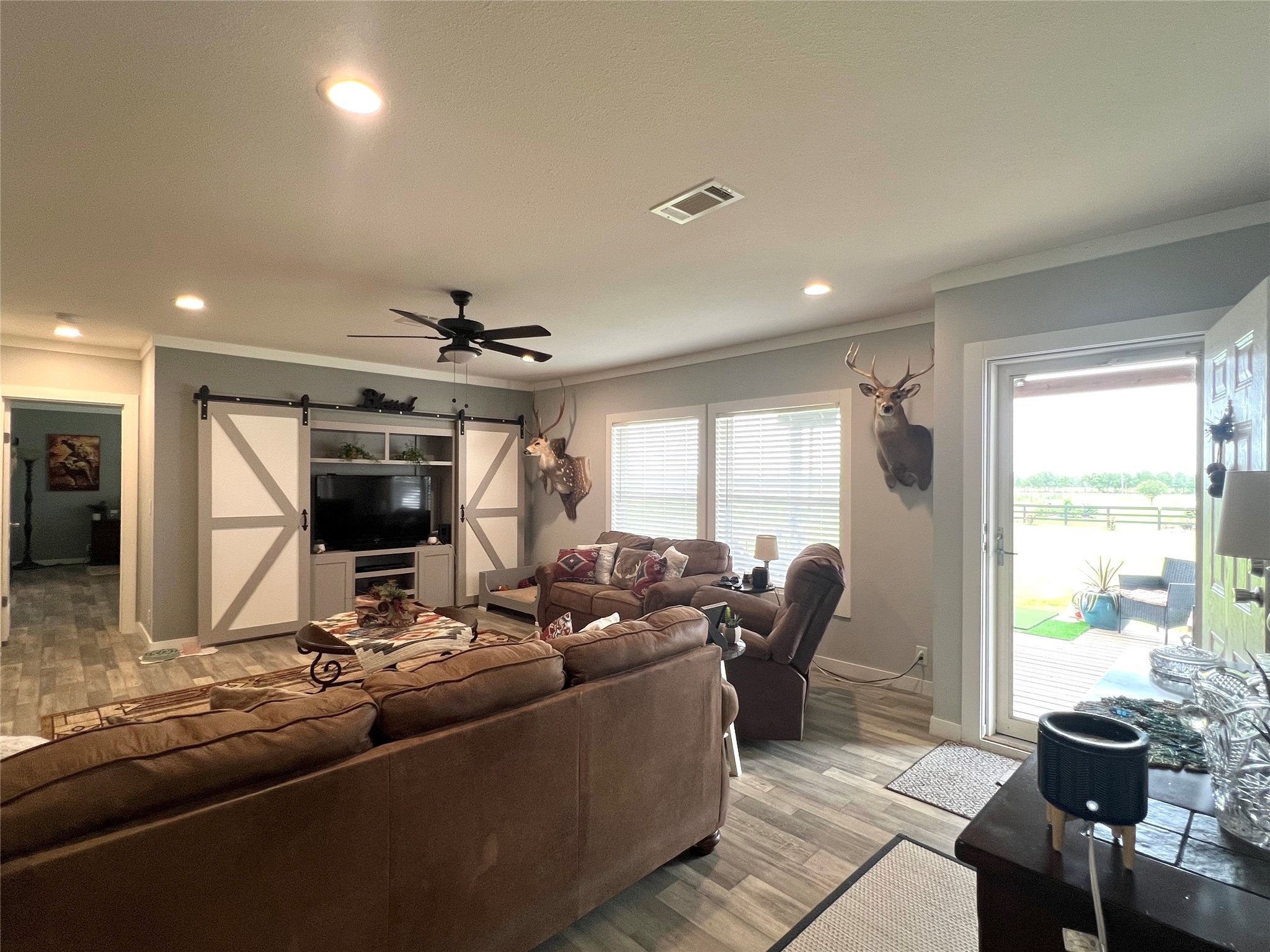 7391 FM 2546 Road El Campo, TX 77437 - Photo 14 of 50 a living room with furniture and a flat screen tv