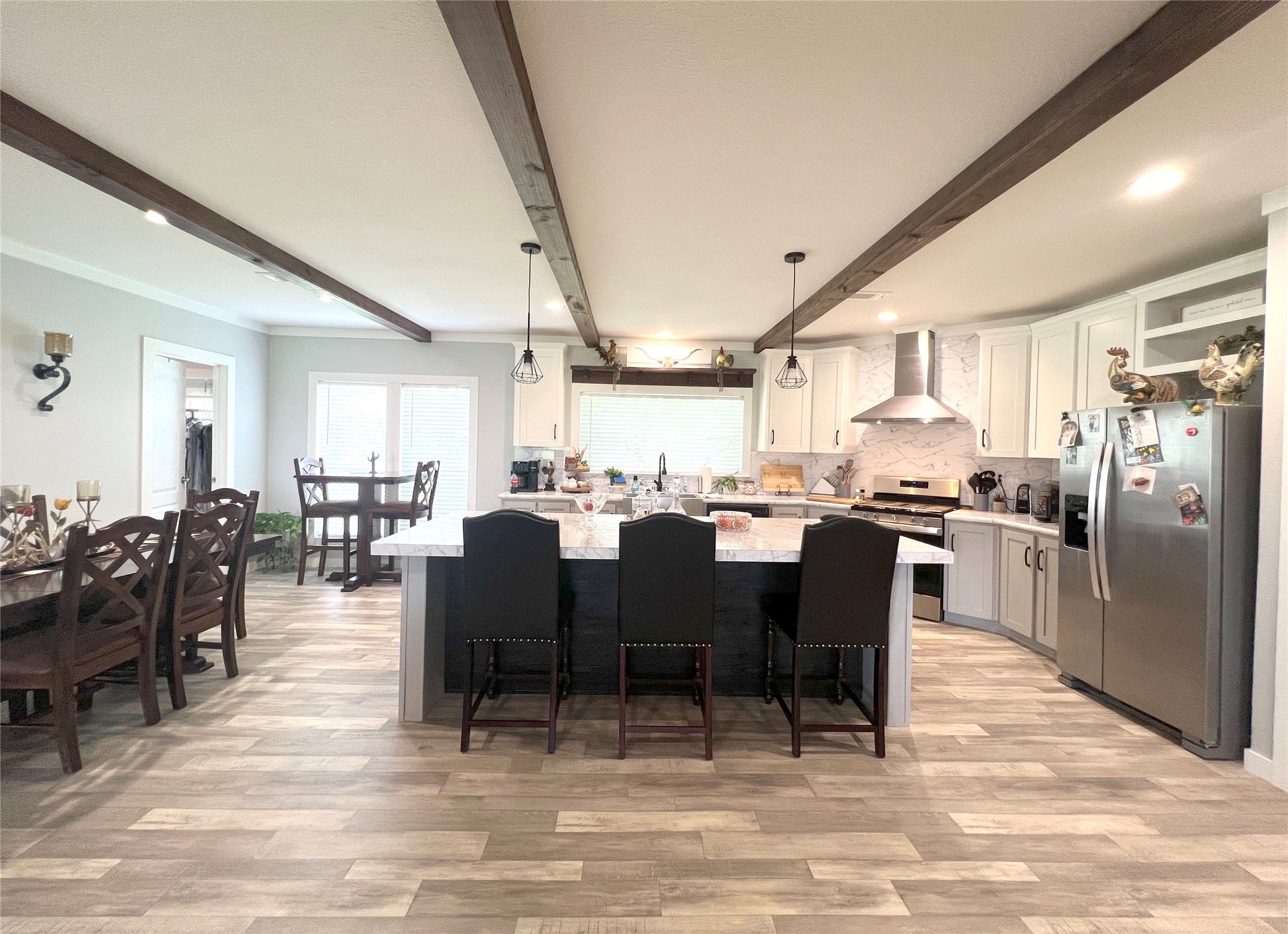 7391 FM 2546 Road El Campo, TX 77437 - Photo 16 of 50 a large kitchen with a table and chairs