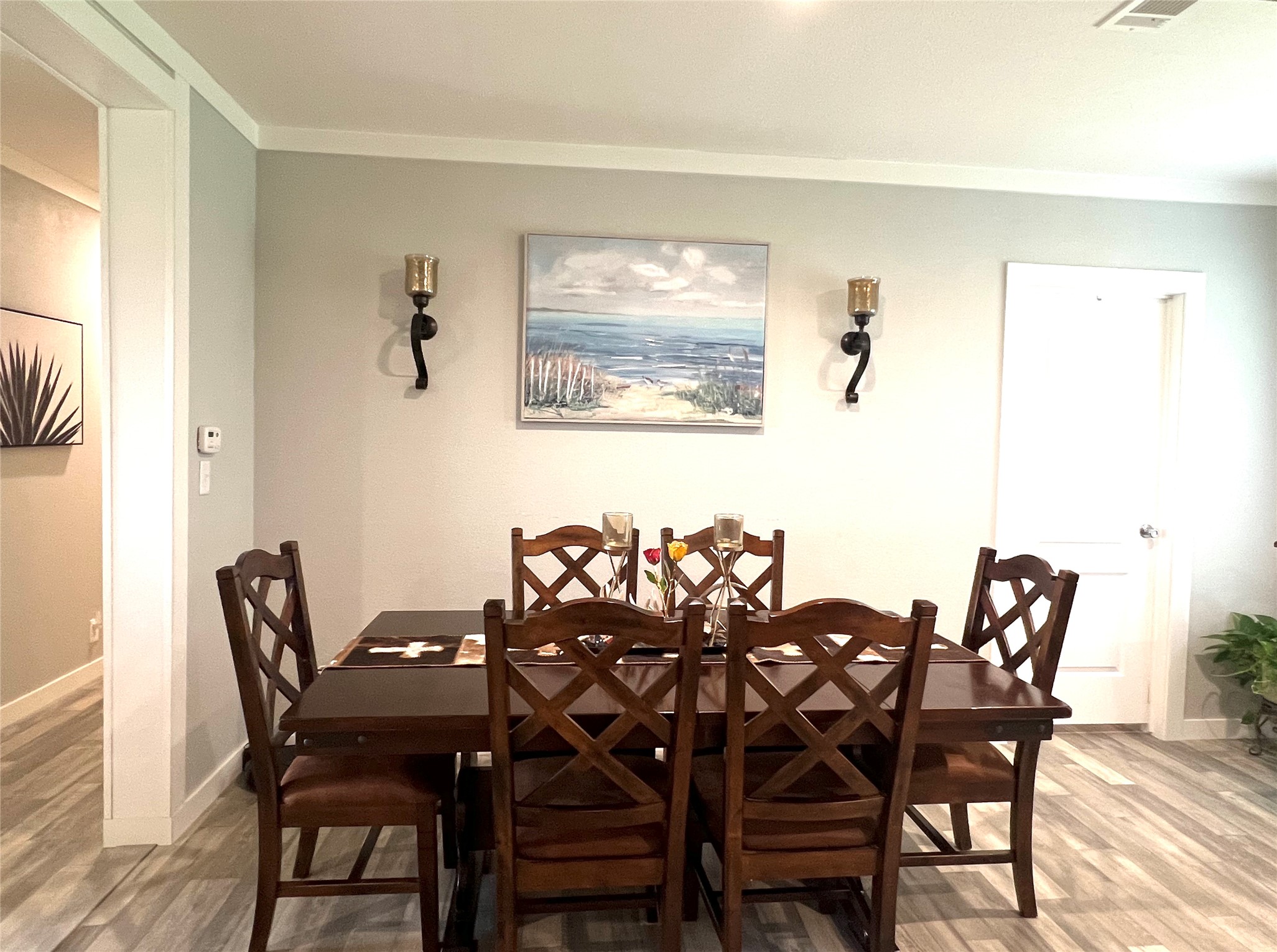 7391 FM 2546 Road El Campo, TX 77437 - Photo 18 of 50 a view of a dining room with furniture and wooden floor