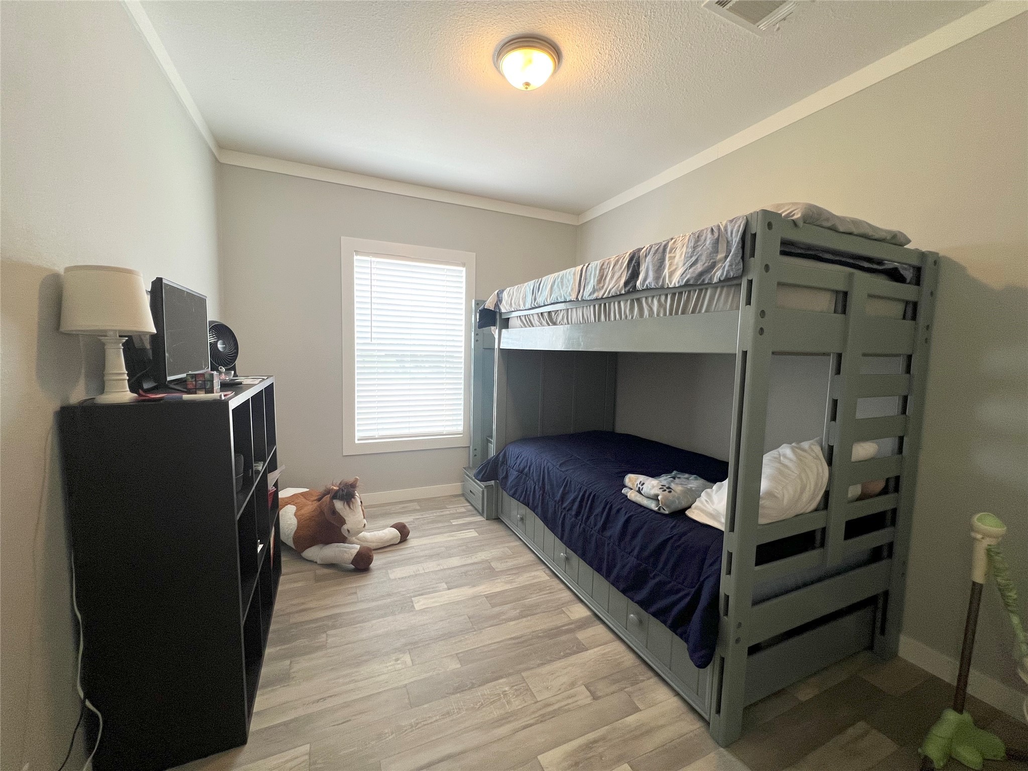 7391 FM 2546 Road El Campo, TX 77437 - Photo 23 of 50 a bedroom with a bed and a window