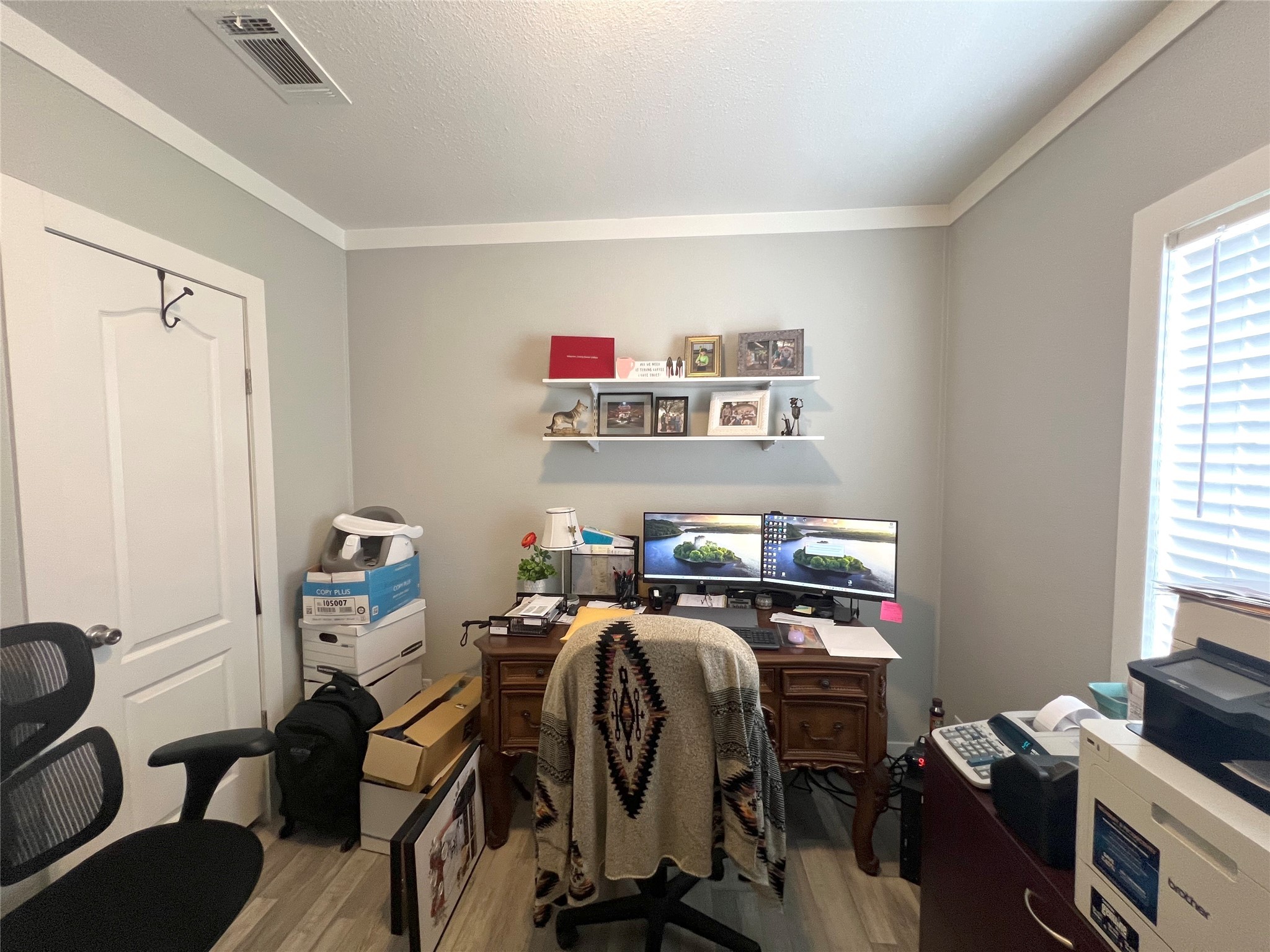 7391 FM 2546 Road El Campo, TX 77437 - Photo 25 of 50 a view of a workspace with furniture and a window
