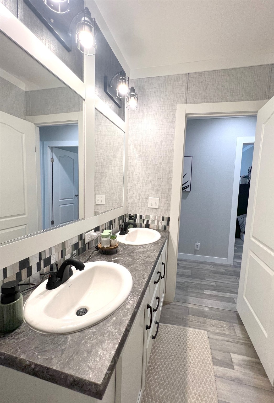 7391 FM 2546 Road El Campo, TX 77437 - Photo 28 of 50 a bathroom with a sink double vanity and a mirror