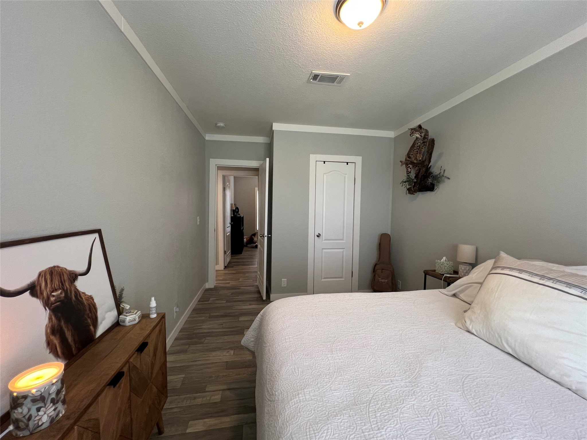 7391 FM 2546 Road El Campo, TX 77437 - Photo 30 of 50 a bedroom with a bed and wooden floor