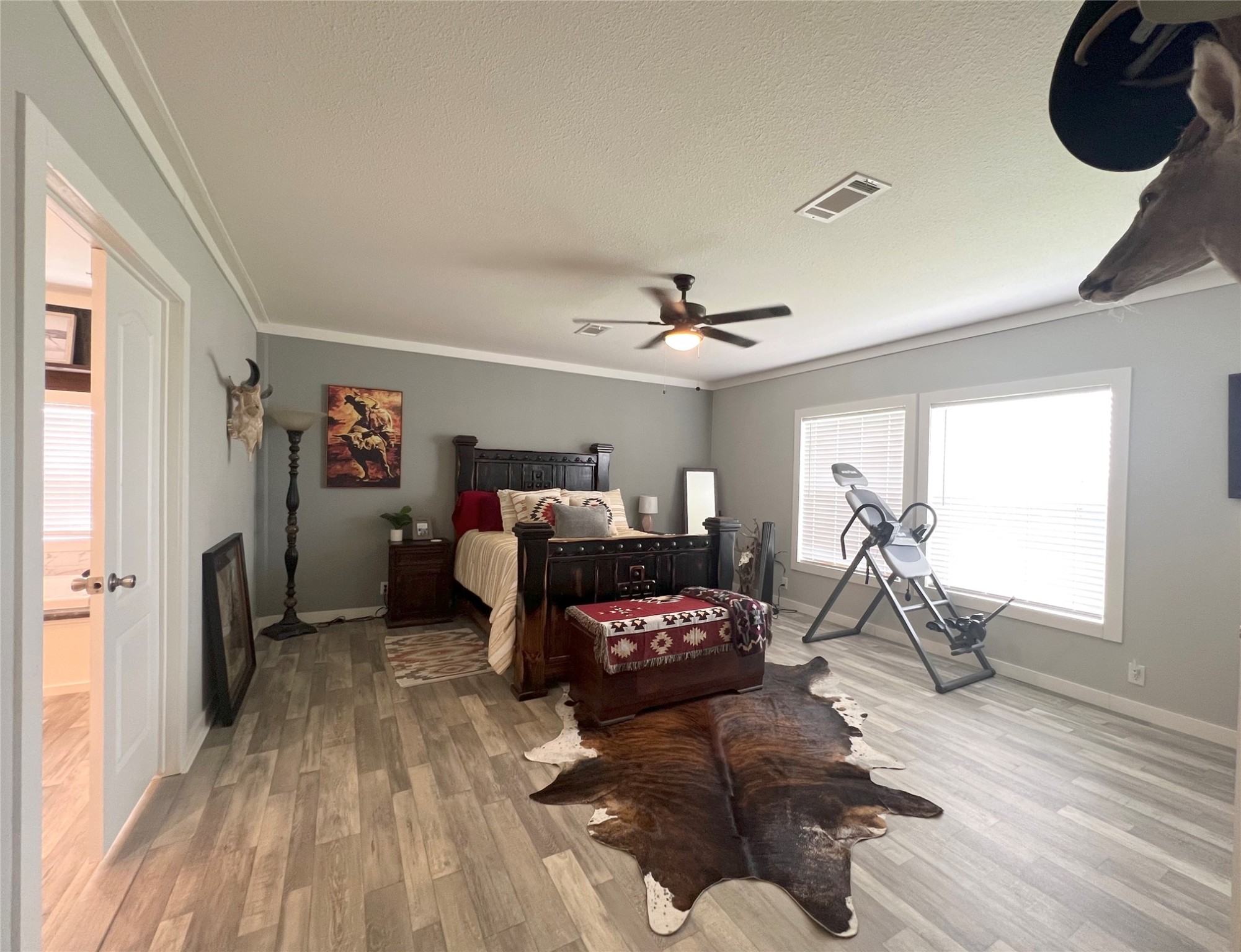 7391 FM 2546 Road El Campo, TX 77437 - Photo 31 of 50 a living room with furniture and a wooden floor